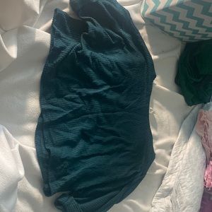 2 “caution of the wind” crop sweaters.